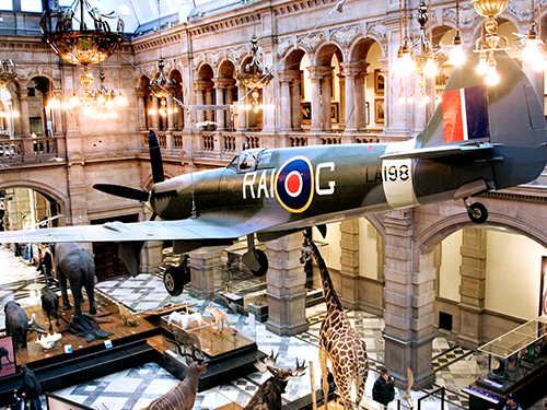 The interiors of Kelvingrove Art Gallery in Glasgow, with model plane and animal exhibits on display
