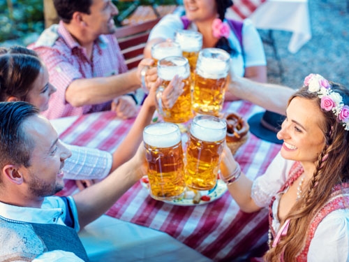 tourists enjoying German beer at Oktoberfest