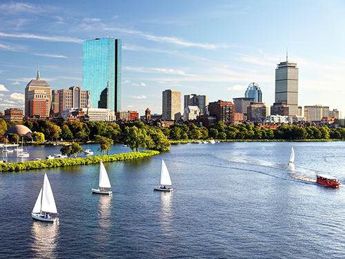 Boats and bus boats are making their way in the Boston city harbour