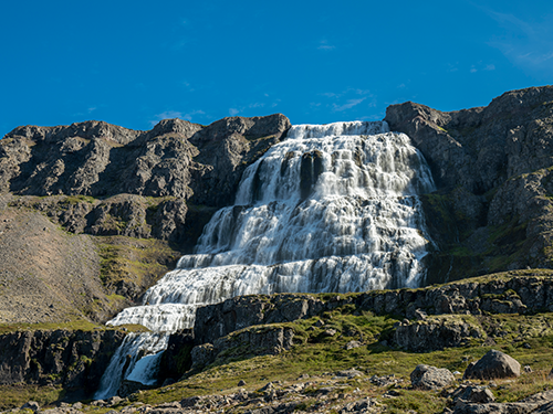 Dynjandi waterfall in the Westfjords of Iceland, pictured on a sunny day