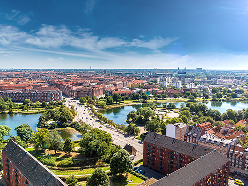 An overhead view of Copenhagen is pictured here, lit up bright by the summer sunshine