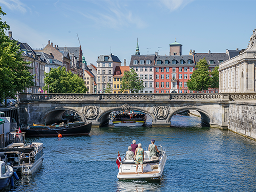 A boat makes its way towards Marmorbroen bridge in Copenhagen