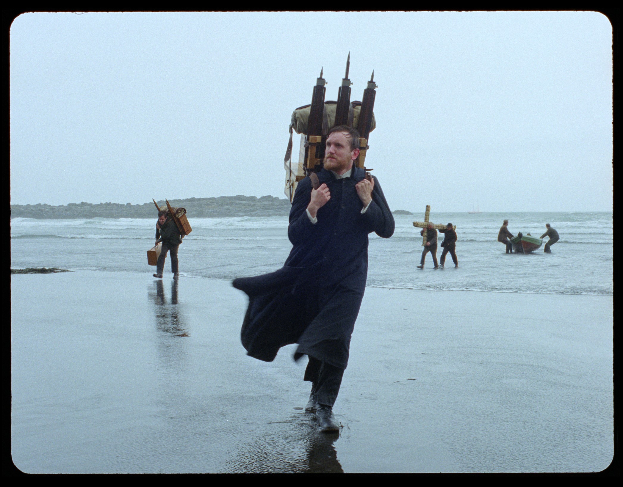 Production photo from the set of Godland the movie, showing the Danish priest arriving on the Icelandic coast
