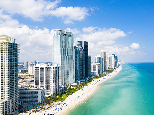 Miami beach and skyscrapers behind