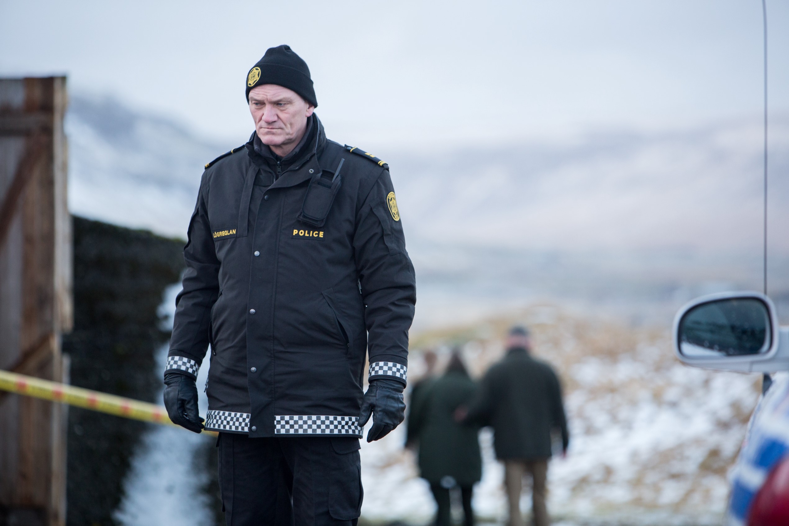 Ingvar Sigurðsson in police uniform in a scene from TV series Trapped