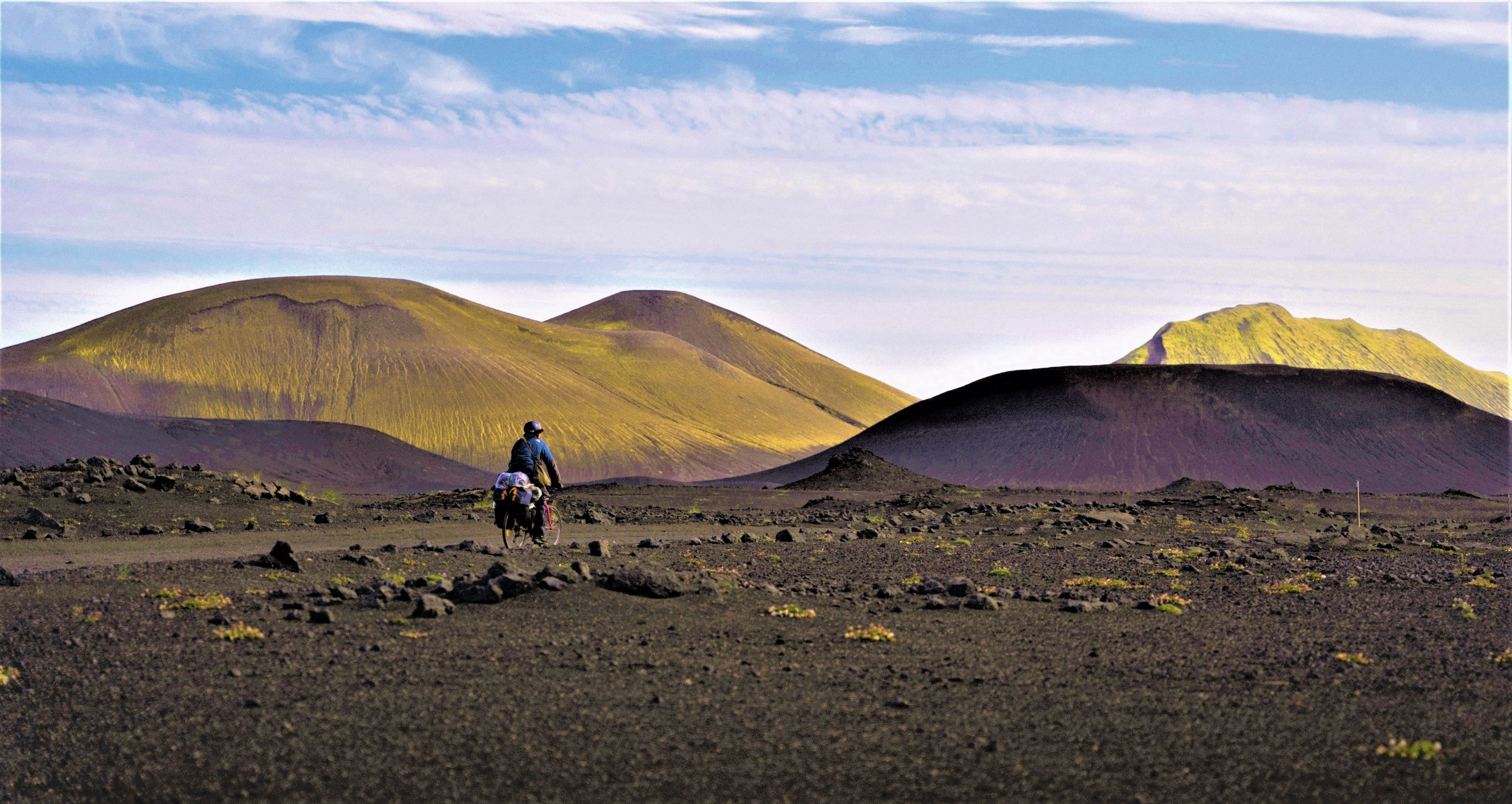 a single person bike packing through the volcanic Icelandic landscape