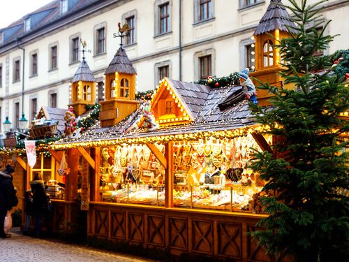a festive booth with lights in a traditional Christmas market