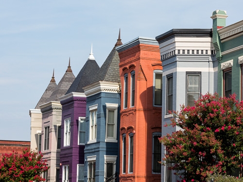 The rooftops of a row of colourful houses in Washington D.C. 