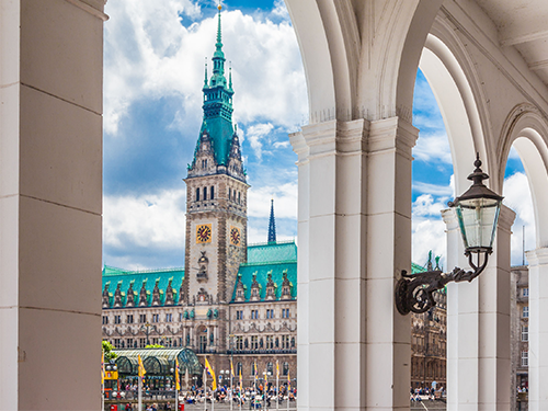 A view of Hamburg Townhall from within the archways nearby