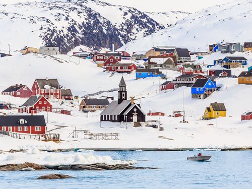 the village of ilulissat is white with snow in the winter