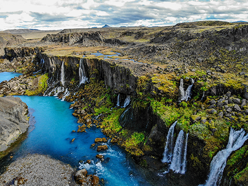 Sigoldugljufur waterfall in the Highlands of Iceland, pictured on a bright summer day  