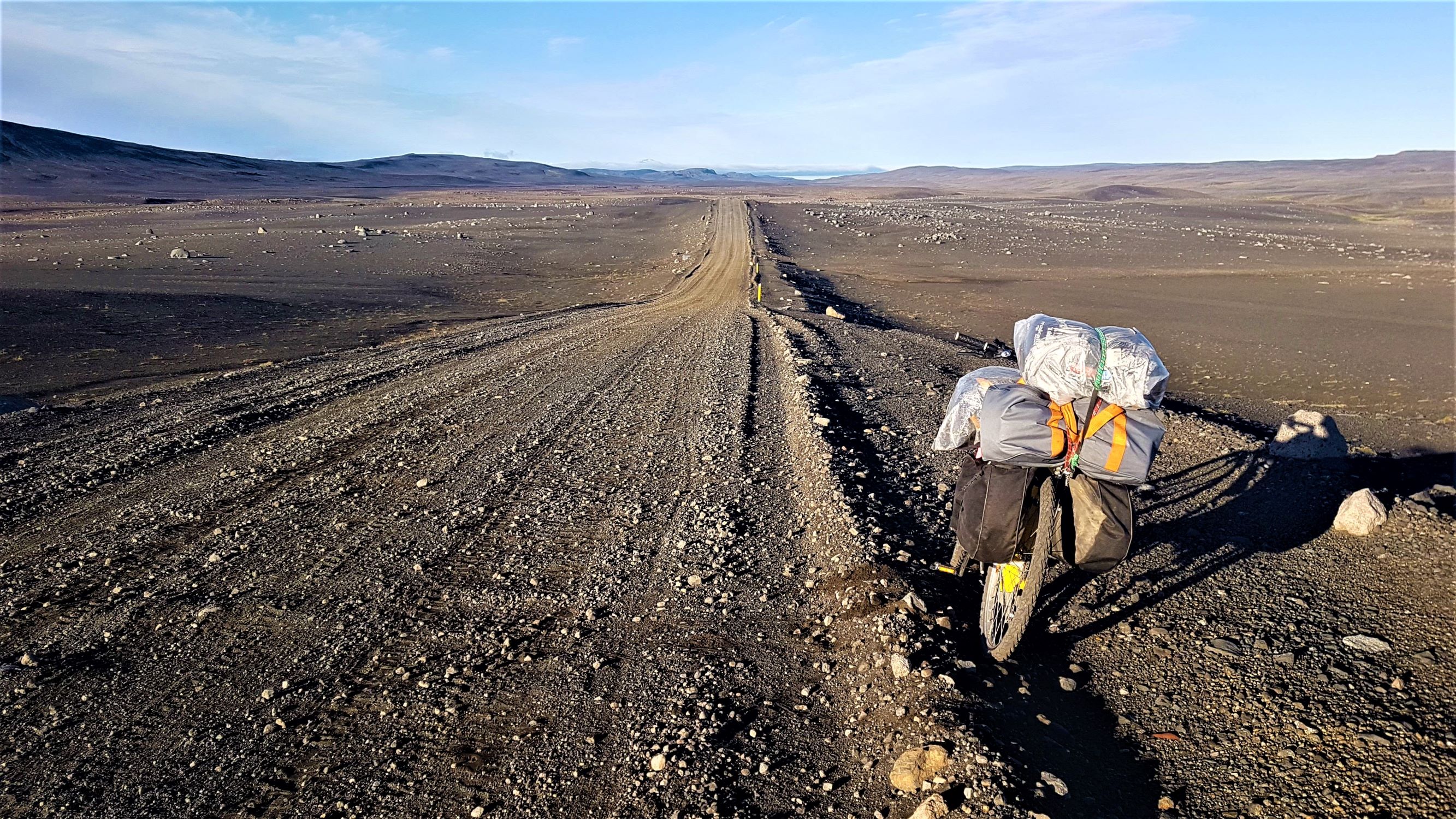 A bike with several bags attached to it, on a bike packing trip through Iceland
