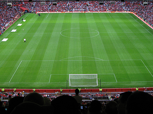 A scene of a crowd watching football in Manchester, as viewed from the top of the stand 