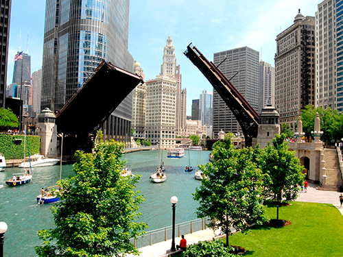 The Michigan Avenue Bridge (also known as the DuSable Bridge) pictured from afar amidst the skyscrapers of the city 