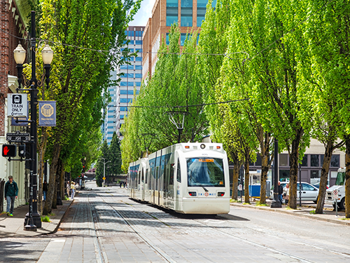 A tram at street view in Portland on a bright day 