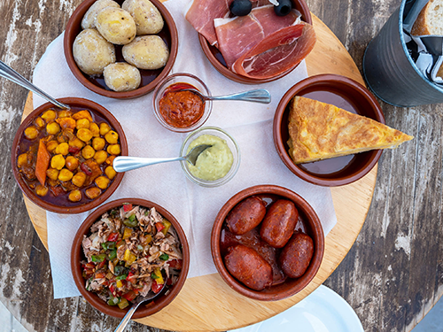 An overhead shot of a smorgasbord of Mediterranean eats in Gran Canaria 