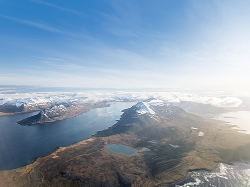  An overhead view of the Westfjords of Iceland on a bright blue sky day