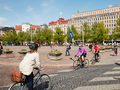 People cycle in all directions in downtown Helsinki 