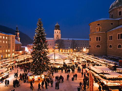 An overhead shot of the winter markets in Salzburg, lit up with Christmas lights