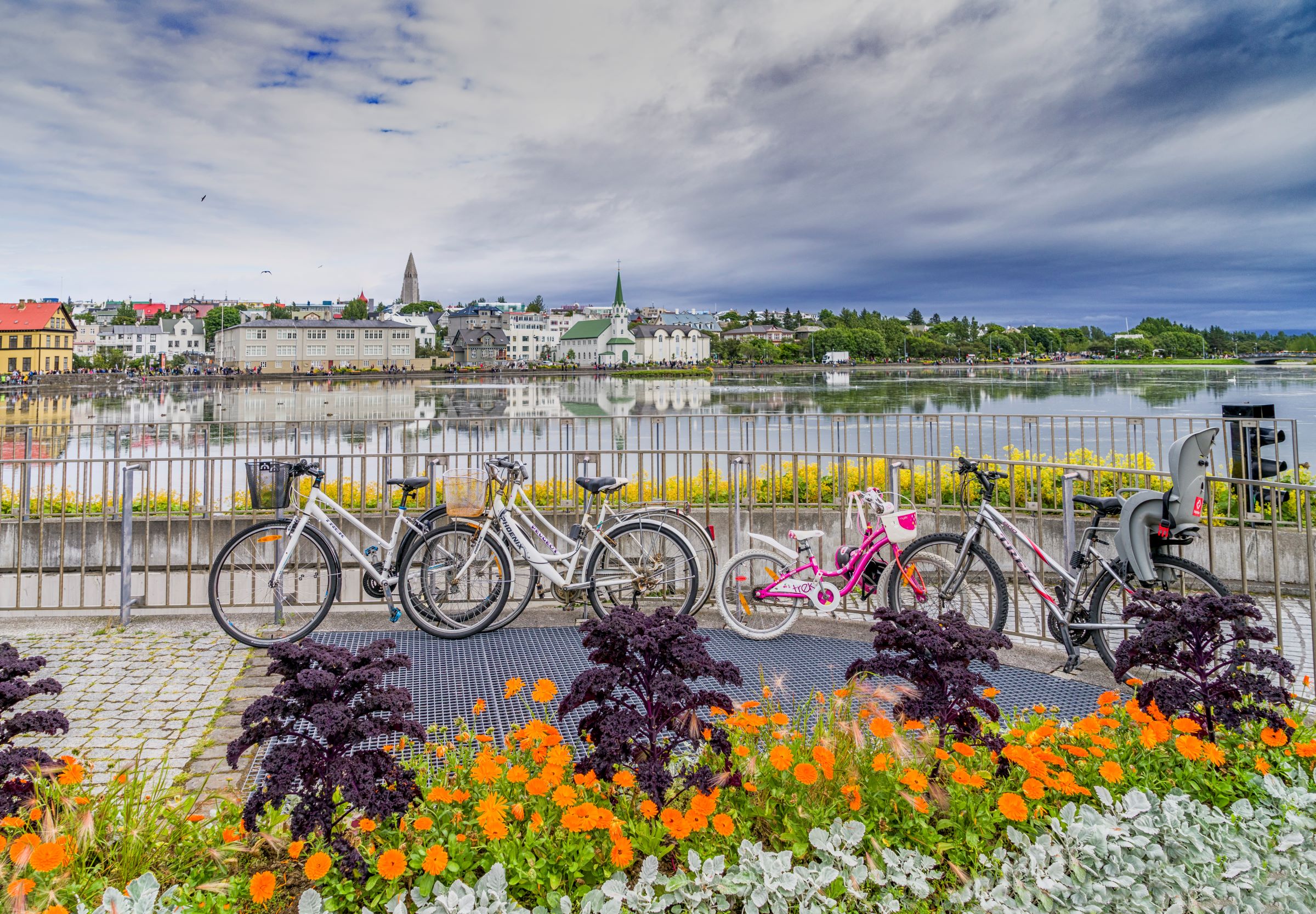 Tjornin lake in Reykjavik pictured from the City Hall side with bikes positioned in the foreground of the picture