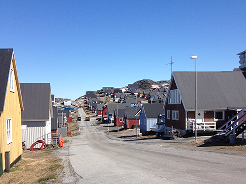 A street view of a colorful street in Nuuk, pictured on a sunny day 