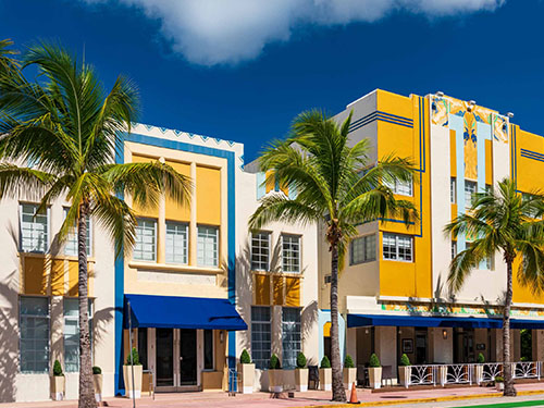 brightly colored buildings along a Miami street