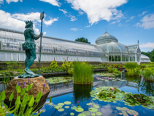 A scene from the Phipps Conservatory and Botanical Garden in Pittsburgh, with the greenhouse in shot 