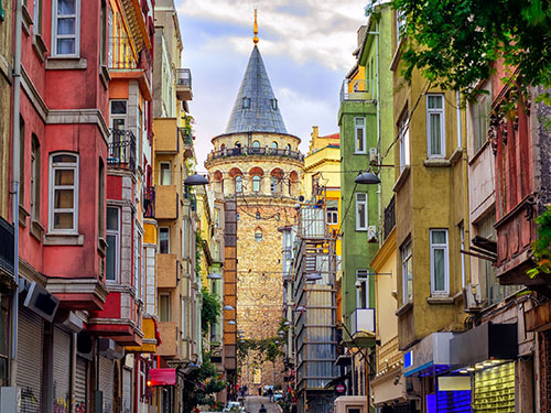 The Galata tower in the historical center of Istambul, seen from the street level