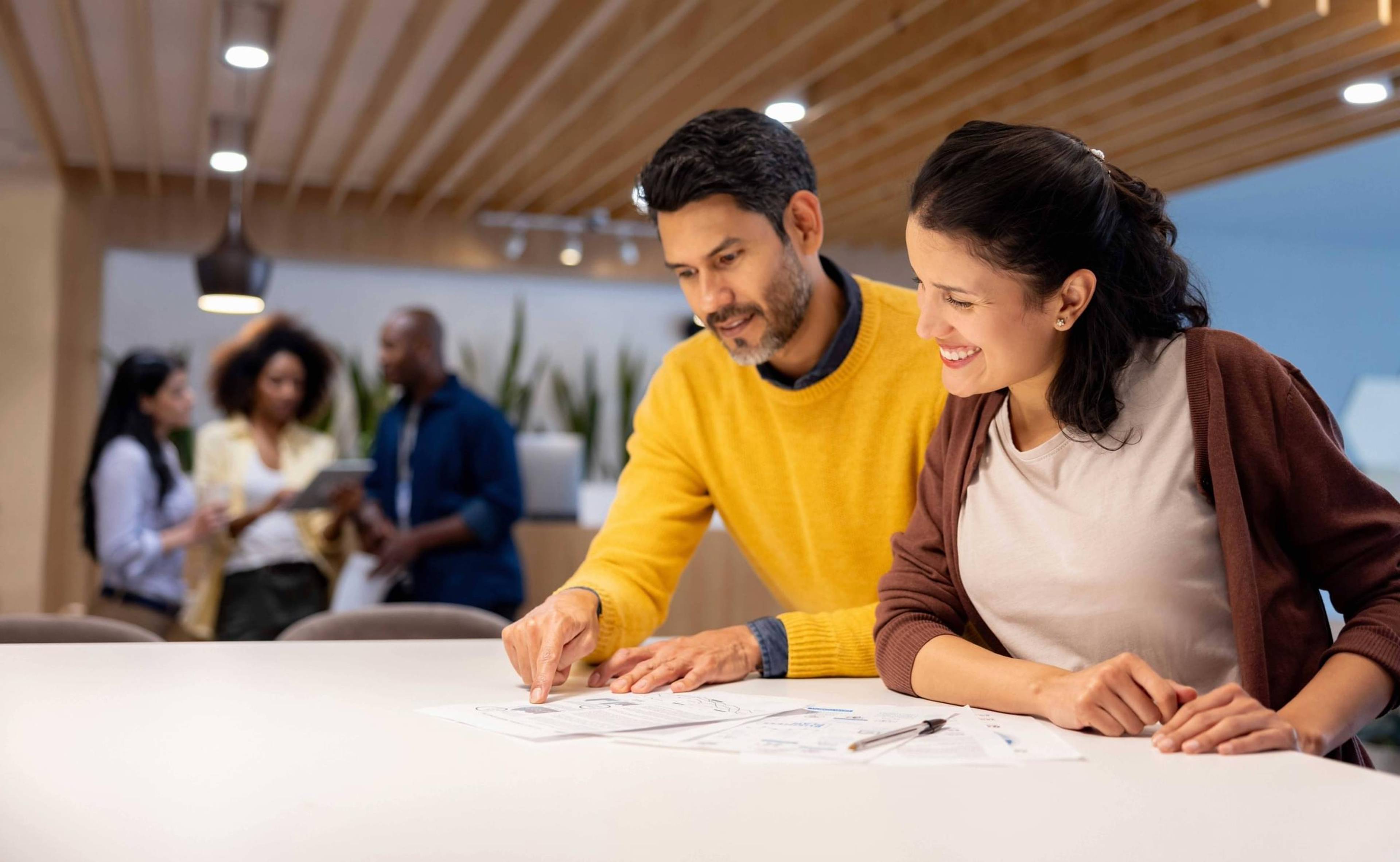 Man and woman going over paperwork.