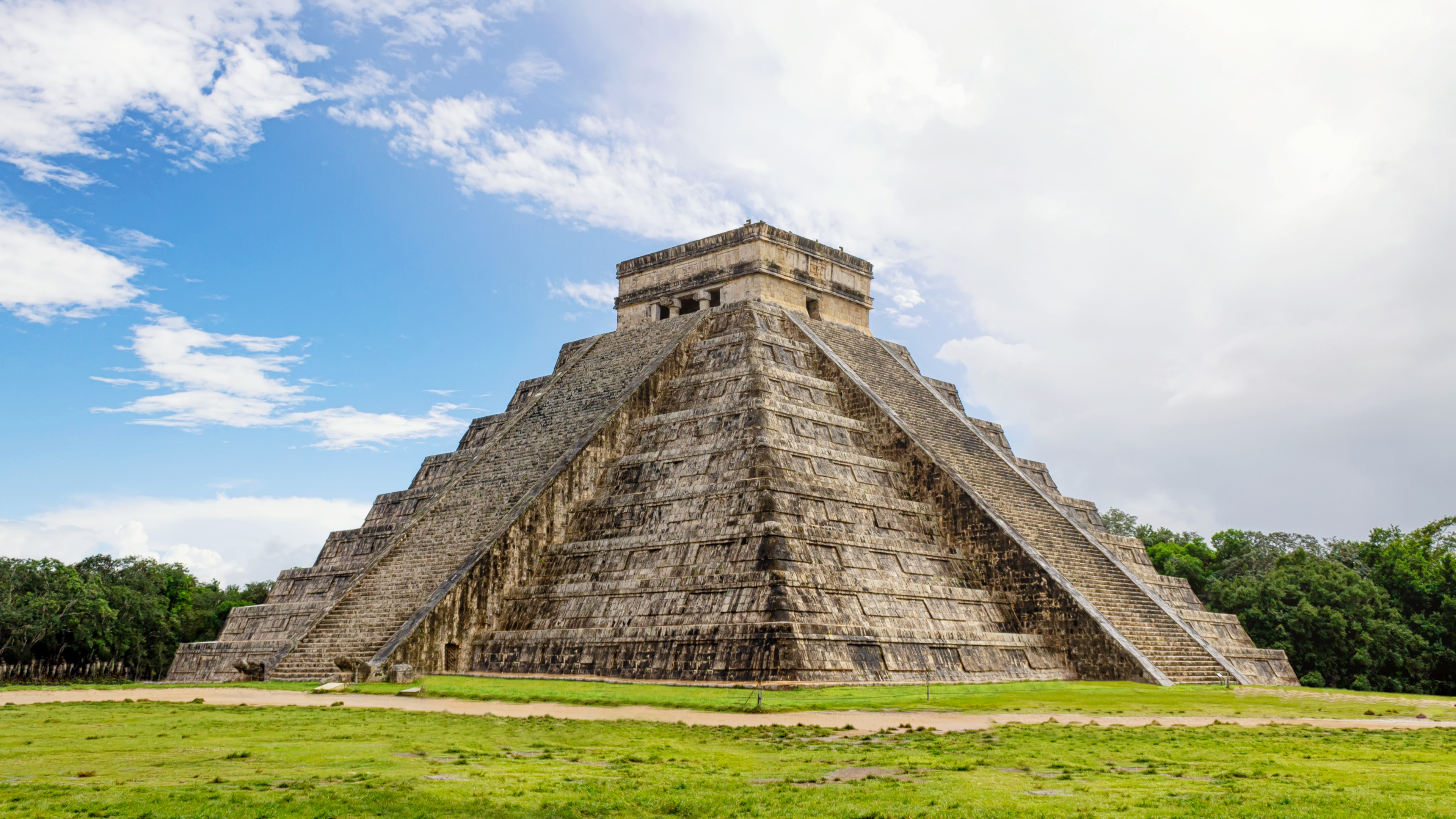 A scenic coastal view of Mexico with turquoise waters and lush greenery