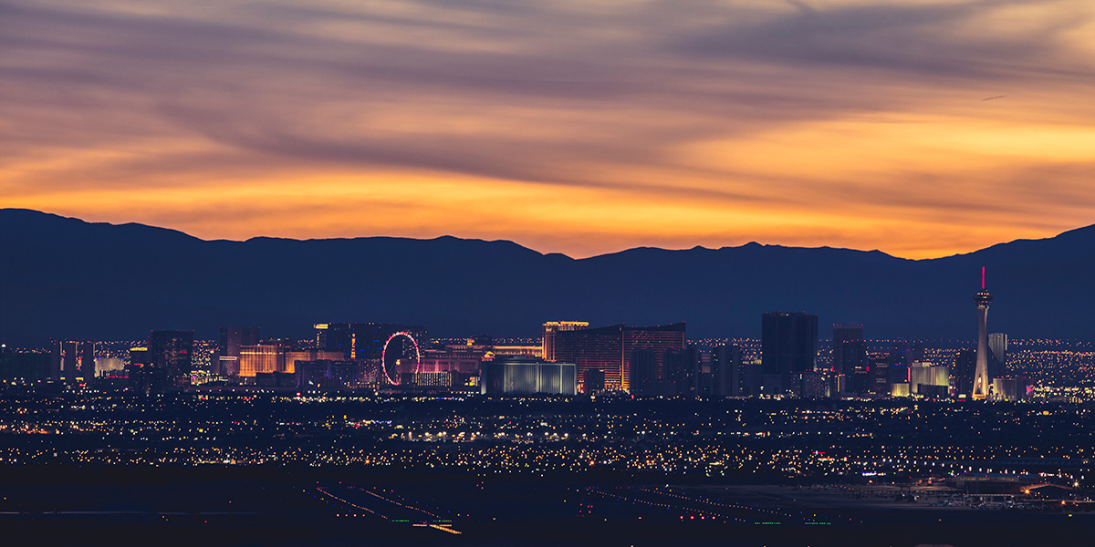 The Las Vegas Strip illuminated at dusk with iconic resort hotels
