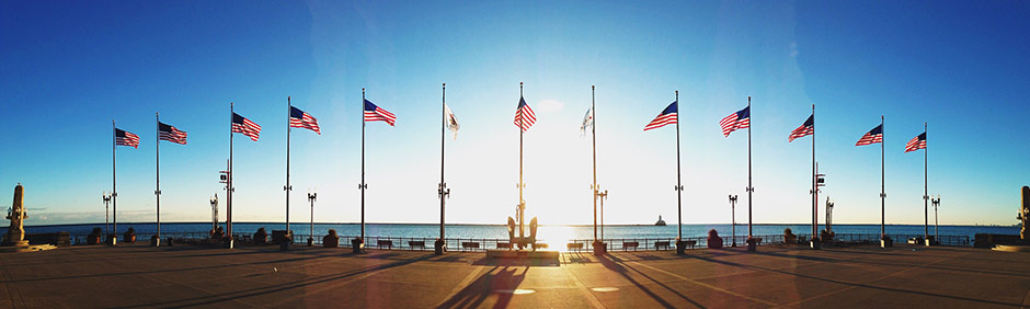 A row of military and american flags