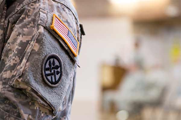 An american flag on a military uniform. 