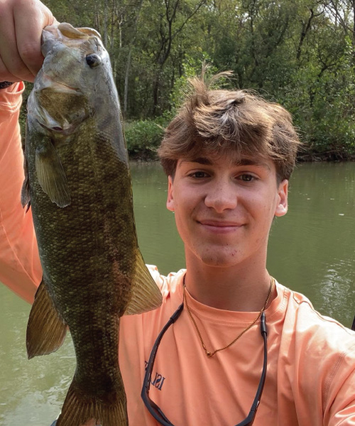 Corey Kiefer holding up a fish