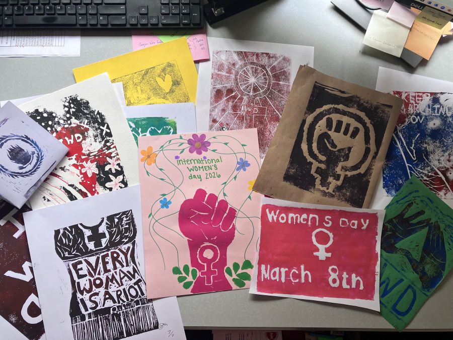 Computer keyboard sits at the top of the image. The rest of the photo are different women