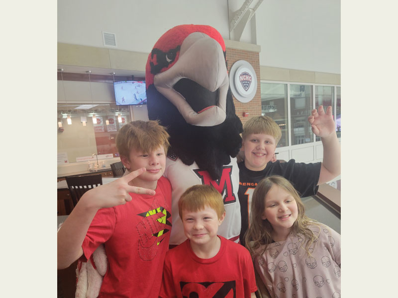 Littles of Big Brothers Big Sister with Swoop at a Miami hockey game
