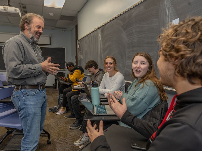 Teacher and students during a classroom discussion.