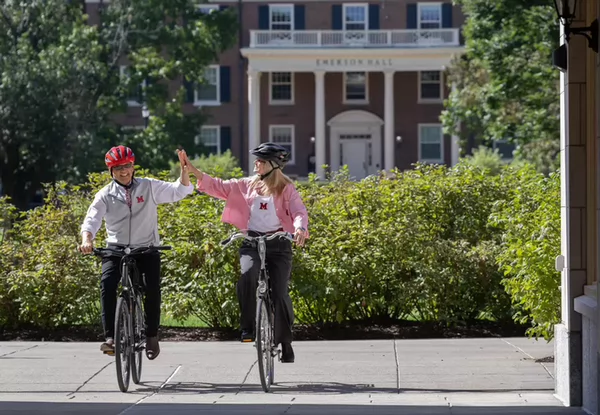 The Crawfords biking on campus on move-in day.