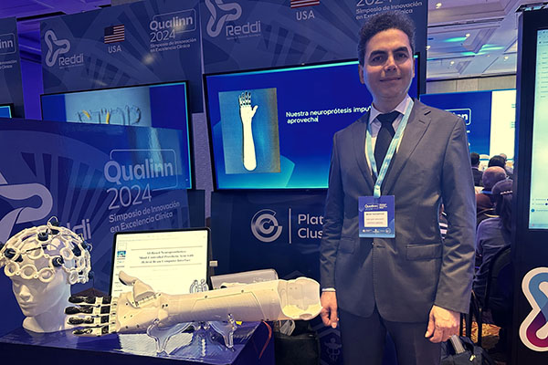 Mahdi Yazdanpour, associate professor in the Department of Engineering Technology holding up his IEEE Region 2 Outstanding Engineering Educator Award