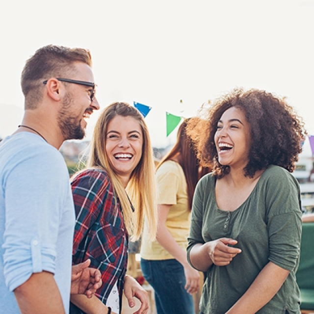 people having a conversation at a fundraising event