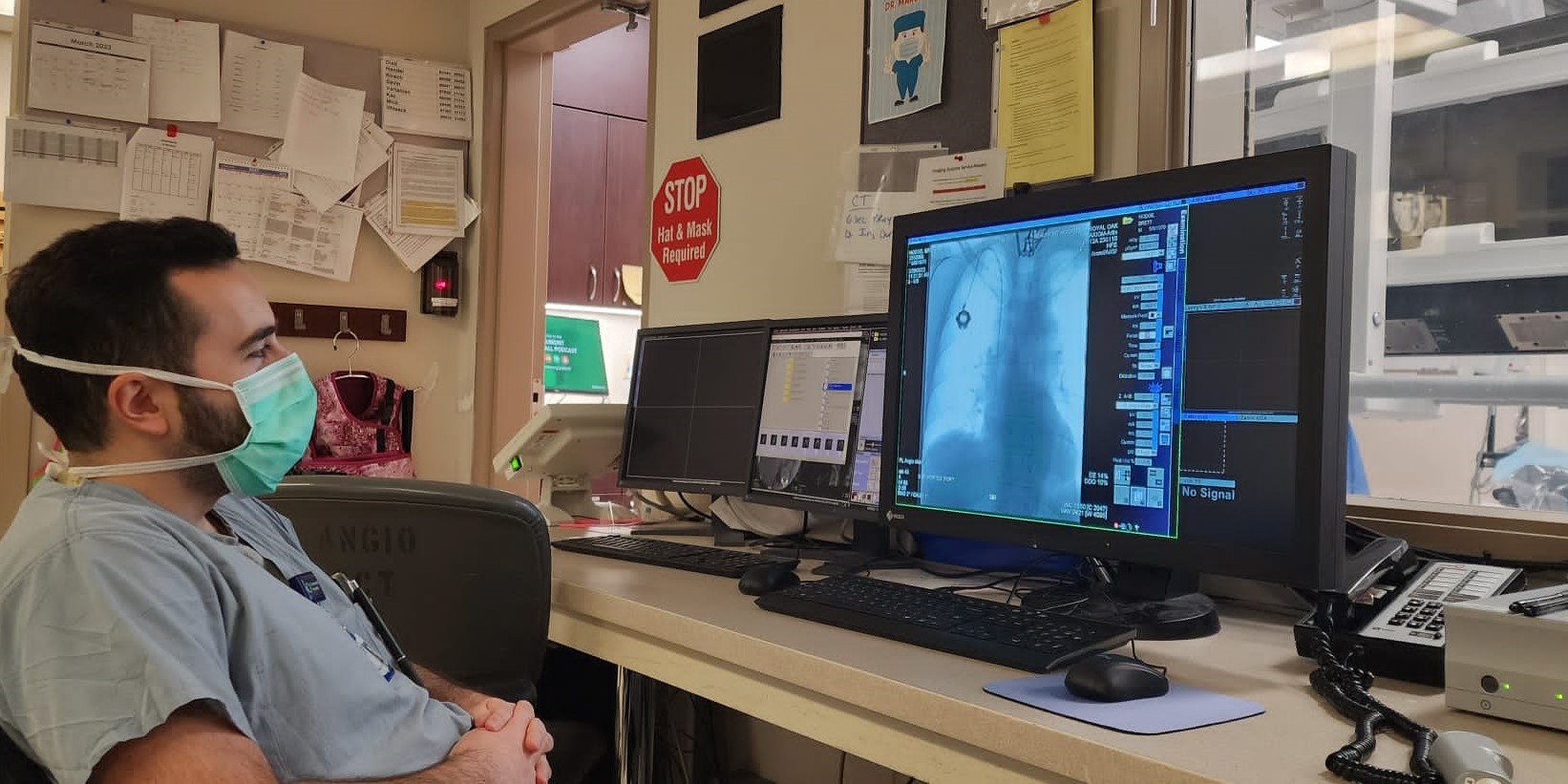 Radiology resident reviewing scans