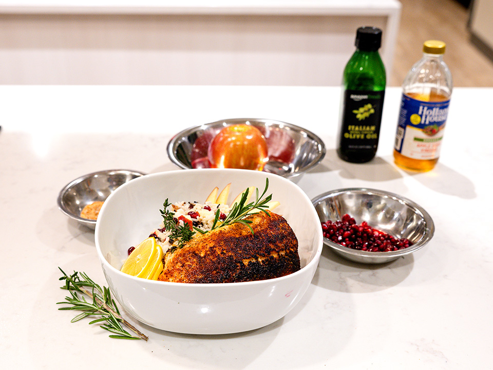A bowl of freshly prepared food is placed on a kitchen counter, displaying an assortment of ingredients and colors.