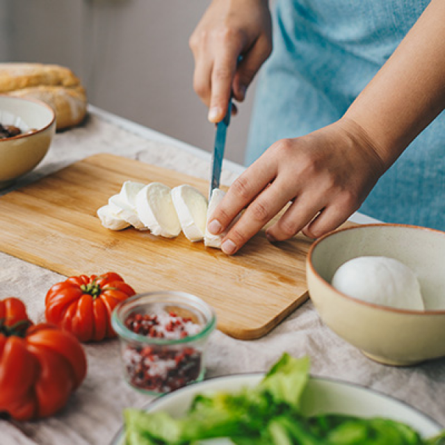 a person preparing food for a mediterranean diet