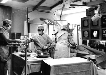Black and white photo of a cardiology team getting ready for a surgery