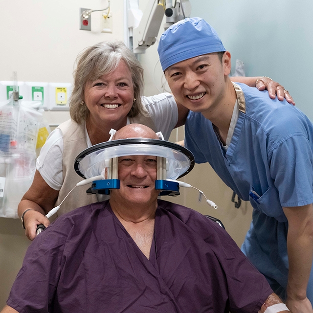 Luyuan Li, MD, with incisionless brain surgery patient.