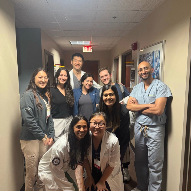 Group of residents posing for a picture during a retina eye clinic at the hospital