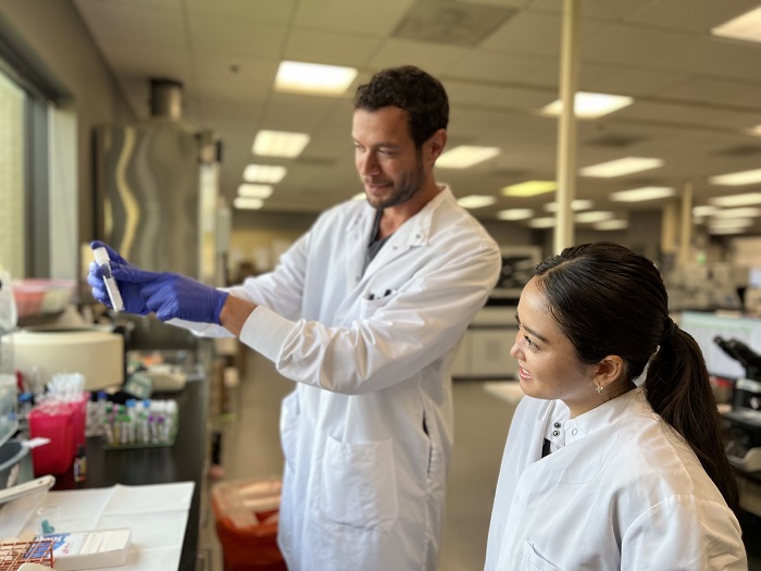 medical laboratory scientists handling fluids