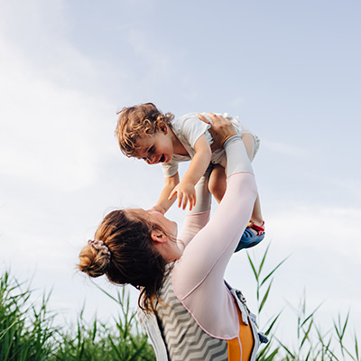 Women holding her child up 