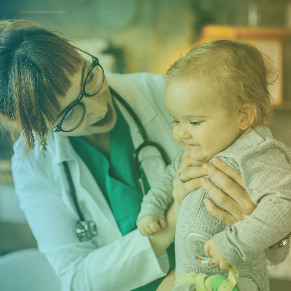 Female Doctor Holding a Baby