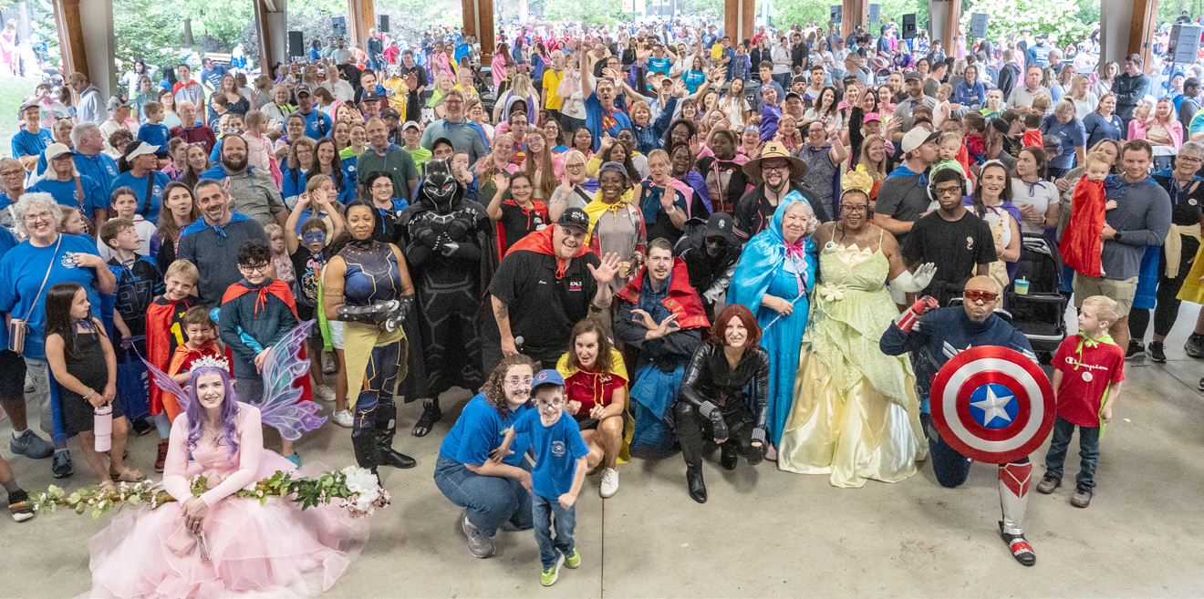 Large group of people some dressed in costumes